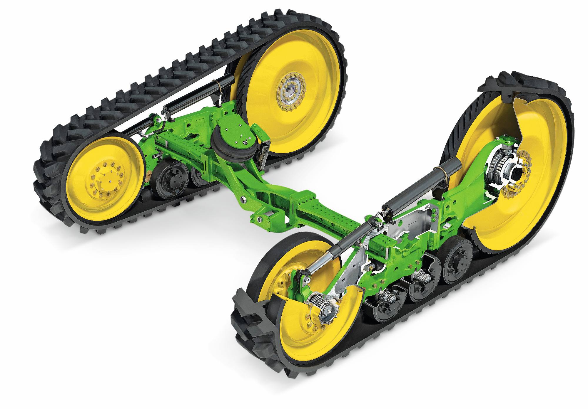 Gusjenični sklopovi traktora John Deere s gumenim gusjenicama, ovjesnim ramenima i žutim pogonskim kotačima prikazani na bijeloj studijskoj pozadini.